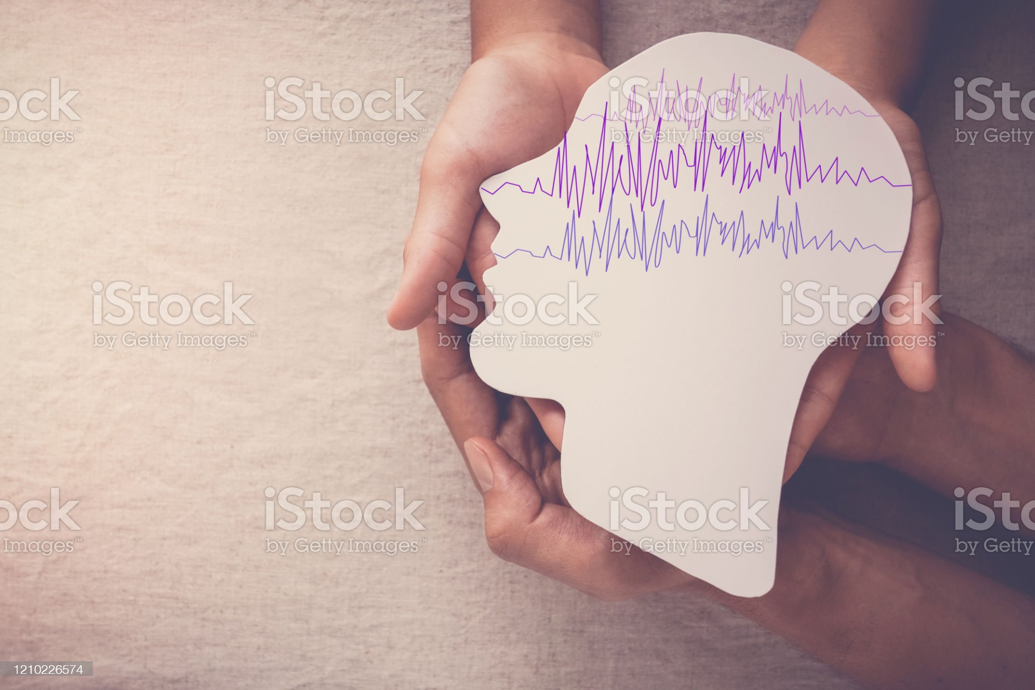 istockphoto-1210226574-2048x2048 Adult and child hands holding encephalography brain paper cutout, Epilepsy awareness, seizure disorder, mental health concept
