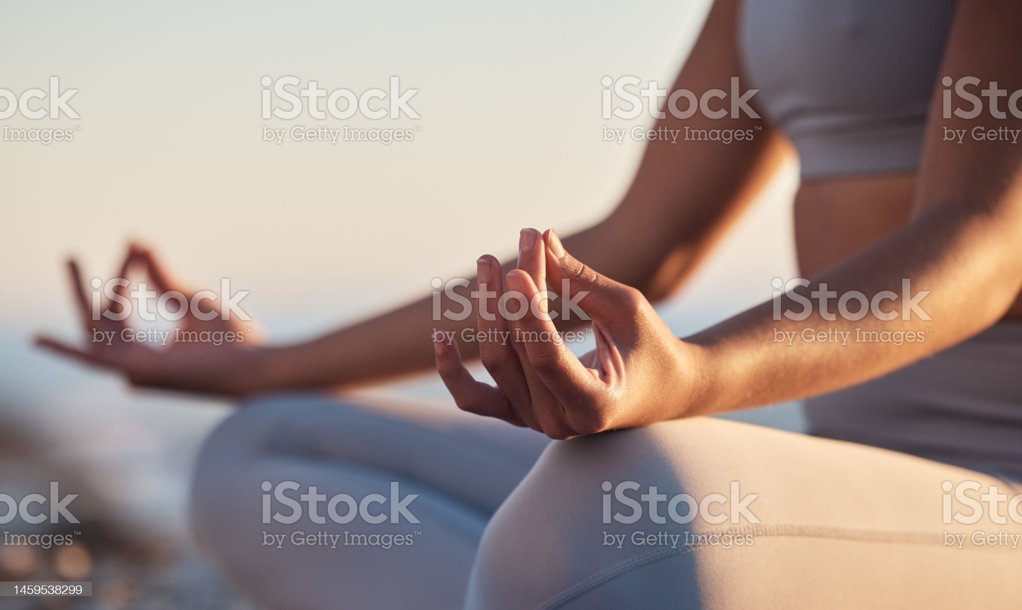 istockphoto-1459538299-2048x2048 Woman, hands or lotus pose meditation on sunset beach, ocean or sea in mental health, mind training or chakra balance. Zoom, peace or zen yogi in calm mudra, relax yoga wellness or sunrise gratitude
